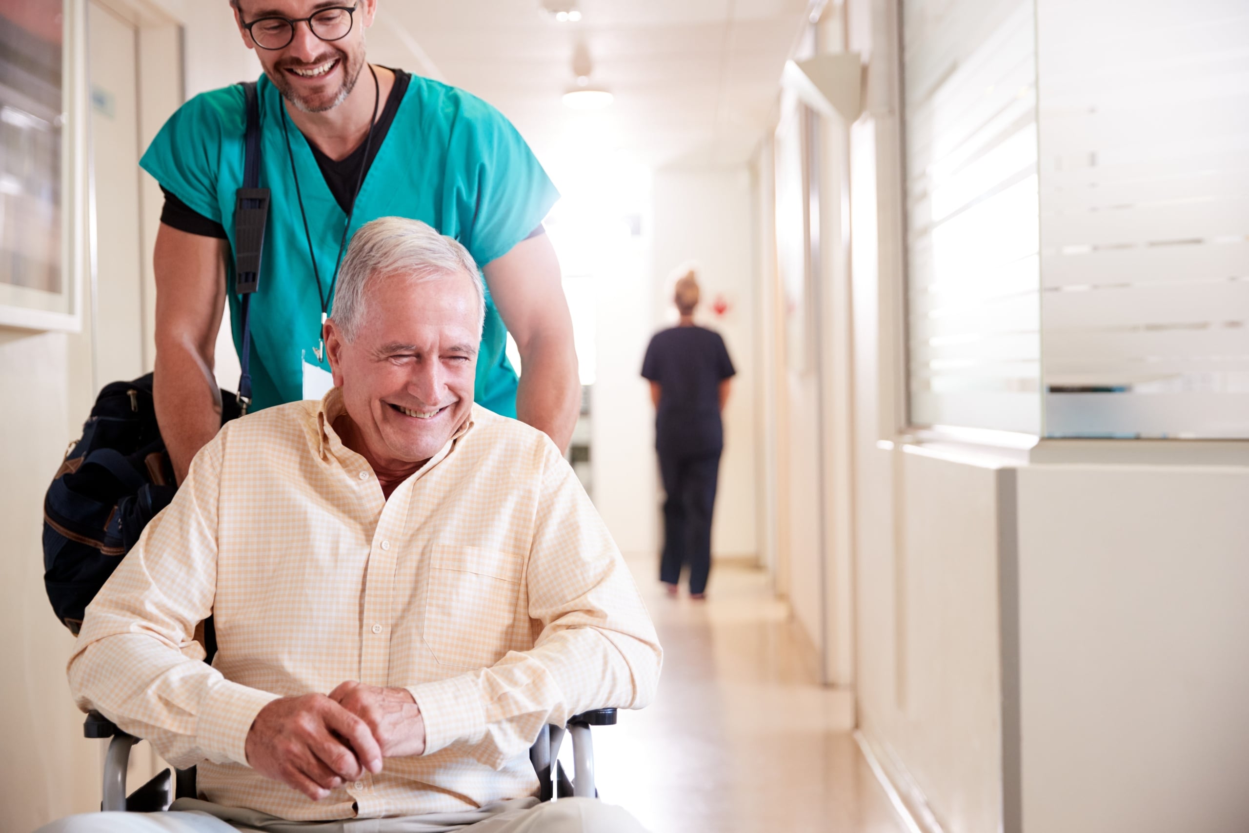 Male nurse with an elderly patient