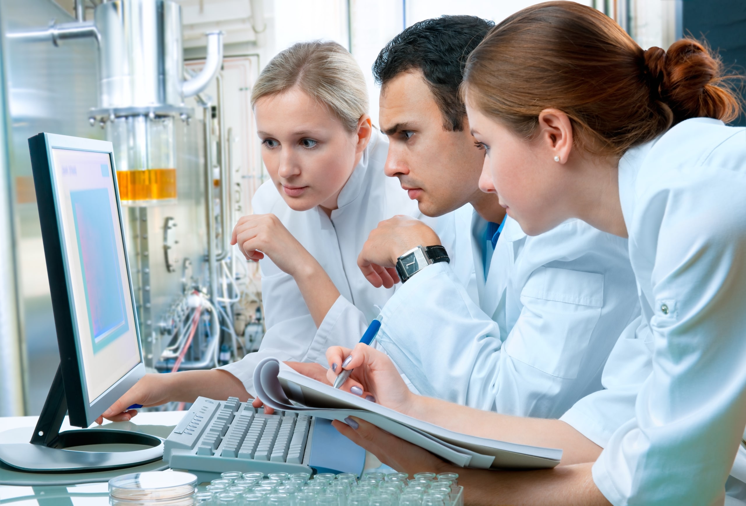 Group of medical workers using a laptop