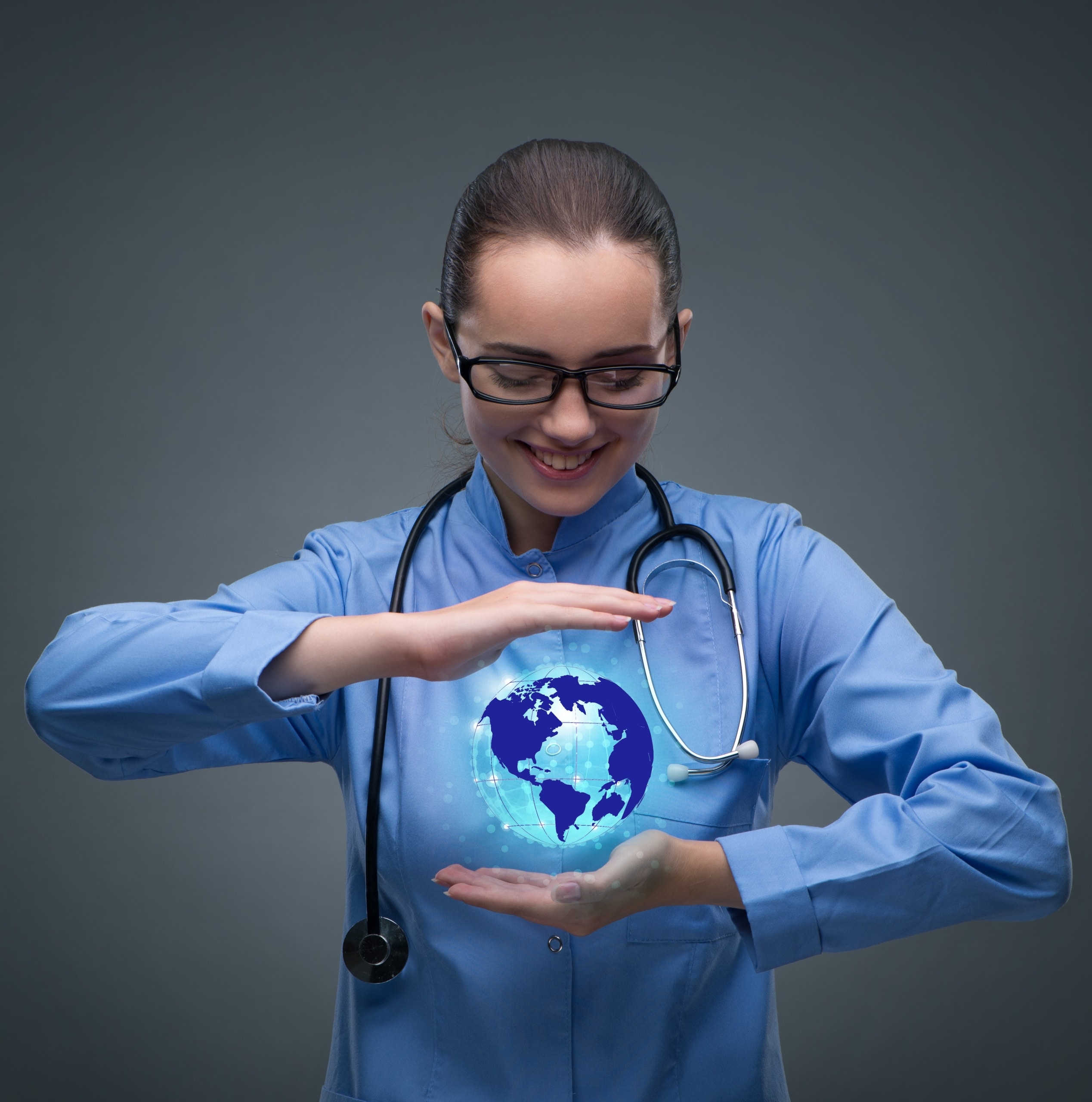 Medical professional holding a virtual globe