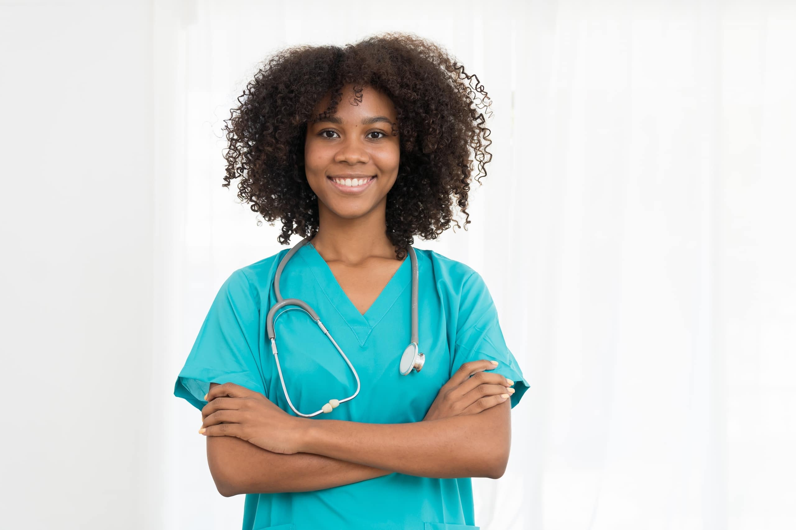 Female African-American medical professional against a white backdrop